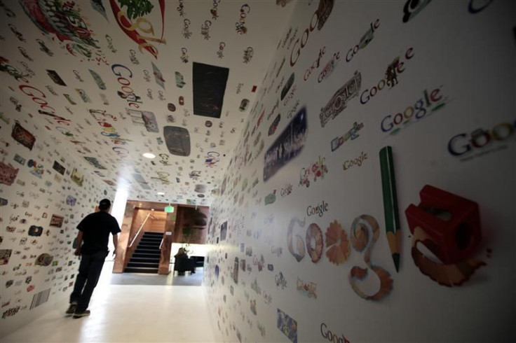 A man walks through a tunnel of Google homepage logos at the Google campus near Venice Beach, in Los Angeles