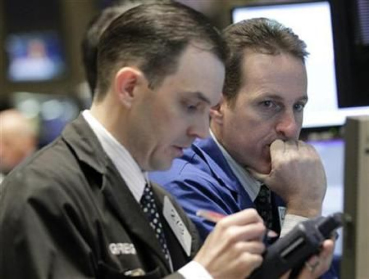 Traders work on the floor of the New York Stock Exchange