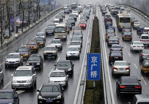 Vehicles are seen on a road in Beijing