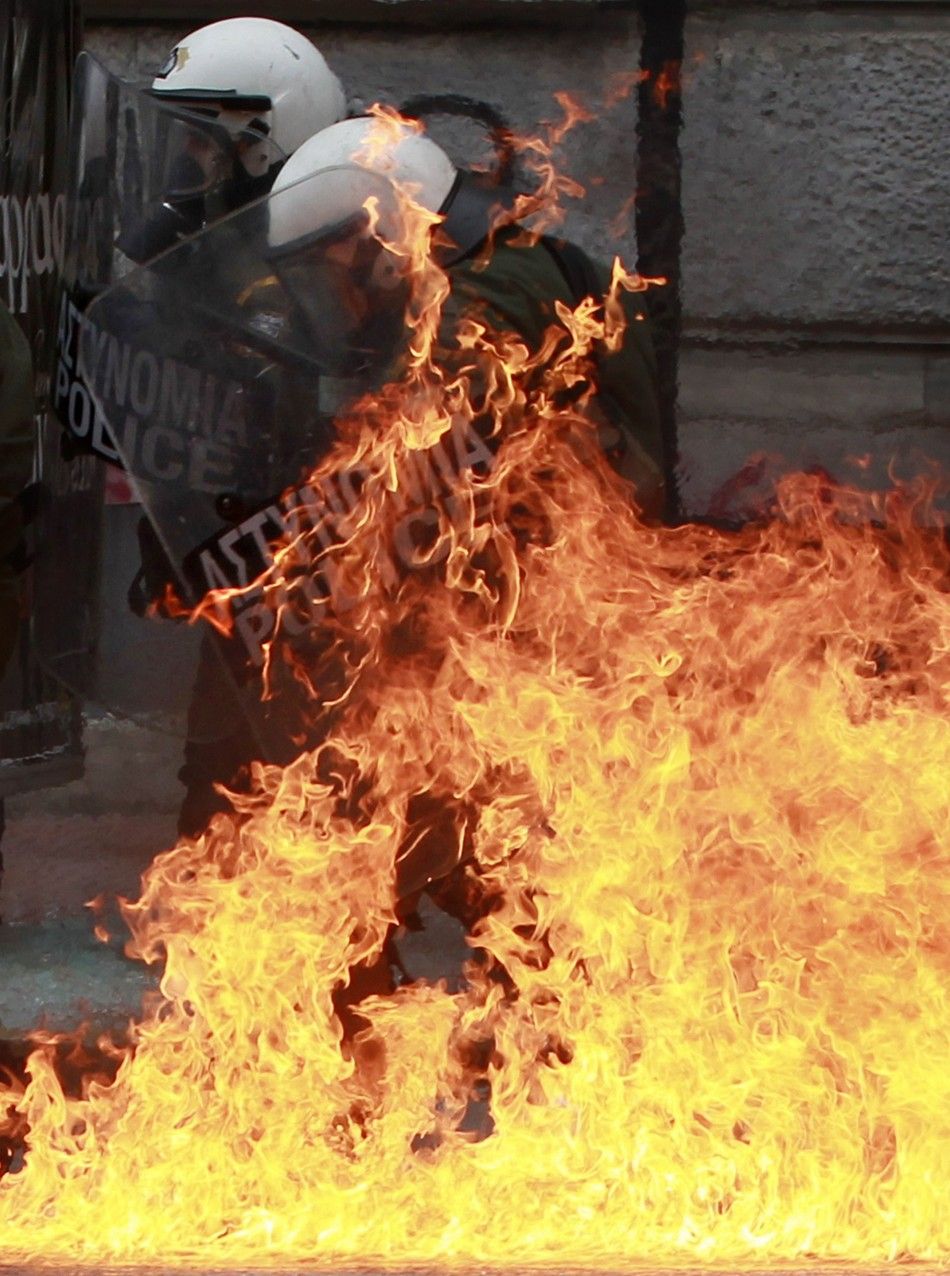 A riot police officer is set aflame by a gasoline bomb hurled at him during Friday039s Athens protests
