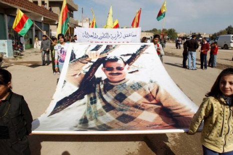 Kurdish carry banner of Ocalan