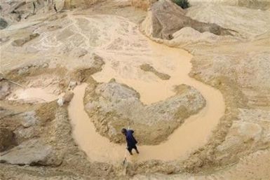 A labourer works at the site of a rare earth metals mine at Nancheng county, Jiangxi province October 29, 2010. 