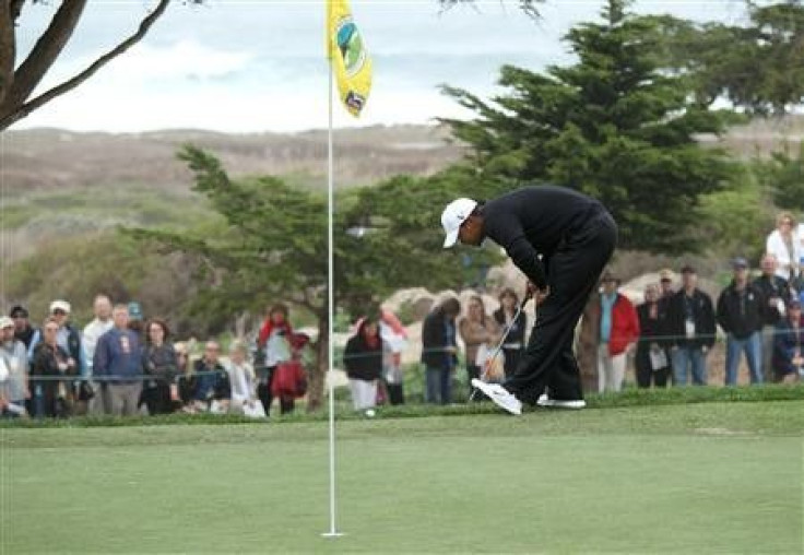 Tiger Woods looks over his shot from just off the green at the 11th hole during the second round of the AT&T Pebble Beach National Pro-AM golf tournament at Monterey Peninsula Country Club in Pebble Beach, California