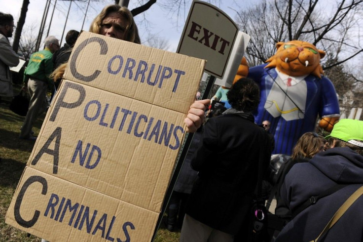 Protesters from the Occupy DC movement and labor unions gather outside the American Conservative Union&#039;s annual Conservative Political Action Conference (CPAC) prior to an address by Republican U.S. presidential candidate Mitt Romney in Washington, F