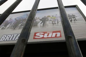 An advertisement for The Sun newspaper is seen on a billboard outside News International's Wapping headquarters in London on Jan. 28, 2012.