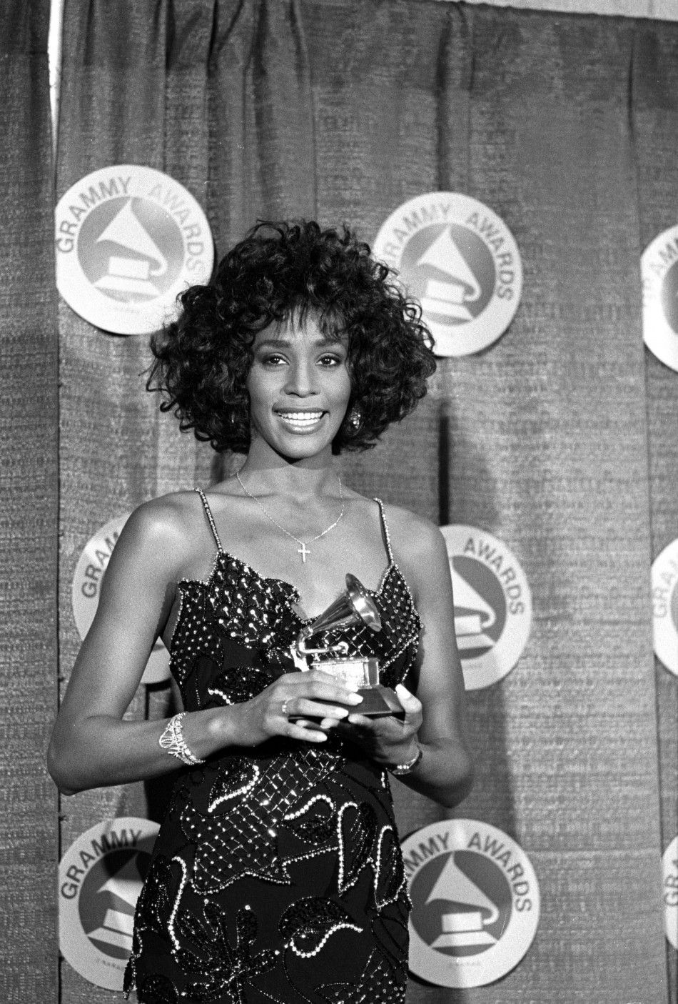 Whitney Houston poses with her Grammy in 1988