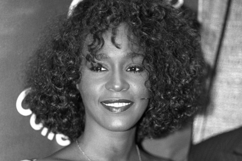 Whitney Houston smiles at a news conference in New York on July 11, 1988