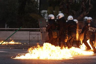 Greece: A gasoline bomb thrown by protesters explodes over riot-control officers