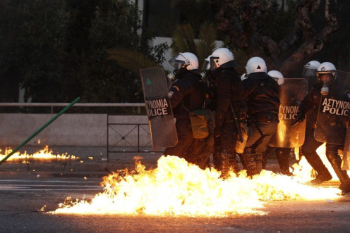 Greece: A gasoline bomb thrown by protesters explodes over riot-control officers