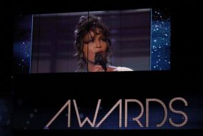 Singer Whitney Houston, who died on February 11, 2012, is shown on a video screen in a 1994 Grammy performance during the 54th annual Grammy Awards in Los Angeles, California