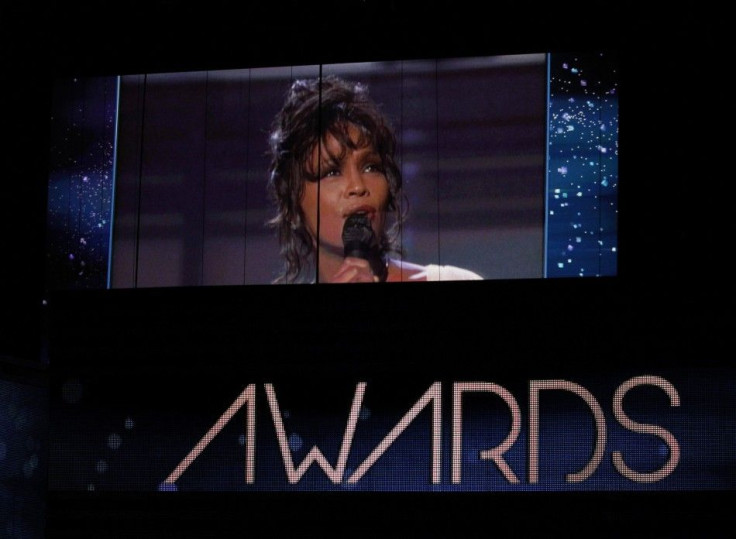 Singer Whitney Houston, who died on February 11, 2012, is shown on a video screen in a 1994 Grammy performance during the 54th annual Grammy Awards in Los Angeles, California