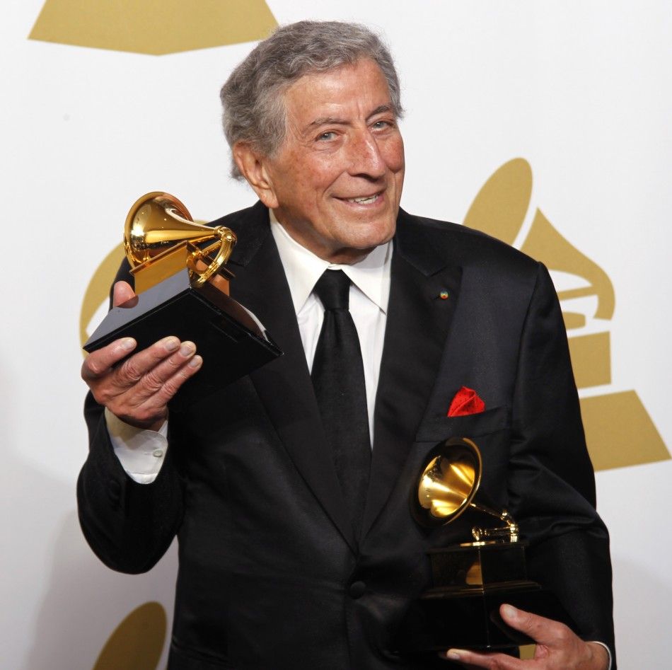 Singer Tony Bennett holds his Grammy awards for Best Traditional Pop Vocal Album quotDuets IIquot and Best Pop DuoGroup Performance quotBody And Soulquot with Amy Winehouse at the 54th annual Grammy Awards in Los Angeles, California