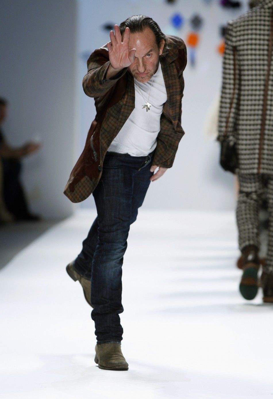 Designer Custo Dalmau acknowledges the audience after the Custo Barcelona FallWinter 2012 collection show during New York Fashion Week February 12, 2012. 