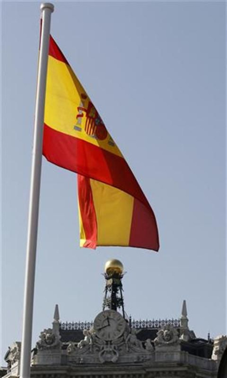 A Spanish flag flutters over the Bank of Spain in Madrid